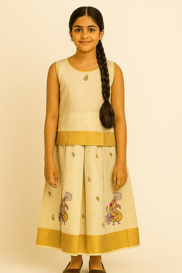 Traditional Off-White Pattu Frock for Girls – Sleeveless Top with Gold Border and Peacock Embroidered Pleated Skirt