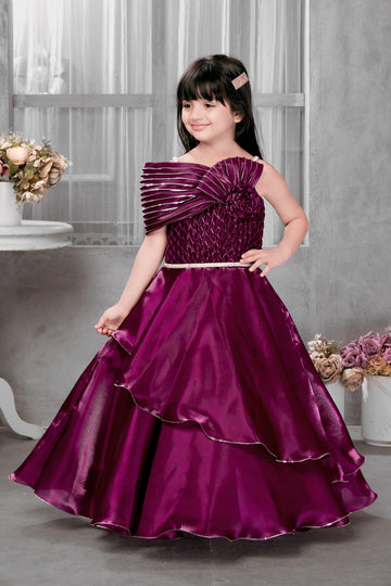 Royal Wine Layered Designer Gown for Girls with Pleated Shoulder & Rosette – Elegant Floor-Length Gown - Inayah Fashion