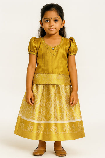 Golden Silk Blend Pattu Pavadai for Girls – Puff Sleeve Blouse with Floral Brocade Skirt and Embroidered Neck